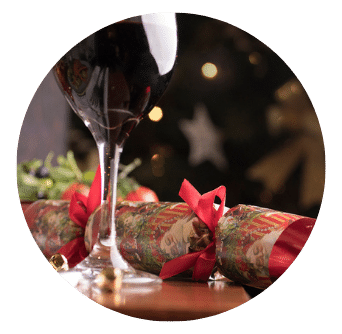 Glass of Red Wine and Christmas Cracker