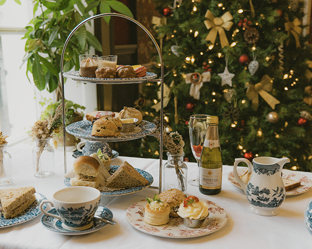 Garden Terrace with tables and chairs and mirror and leafy plants