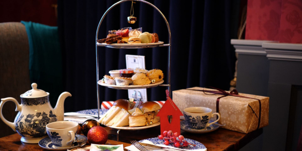 Festive Afternoon Tea stand with Tea pot in beautiful setting